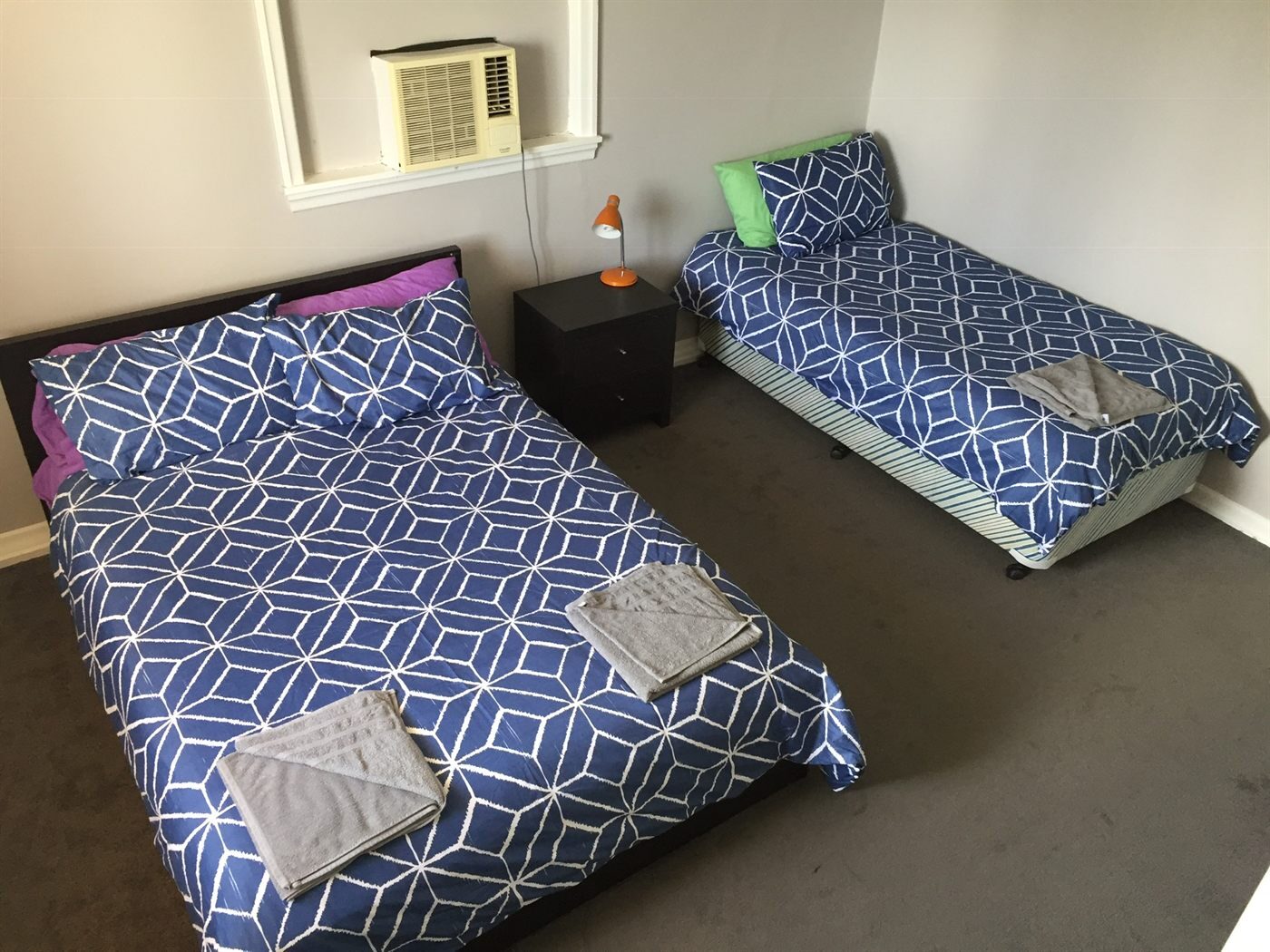 Guest room with a double bed and a single bed